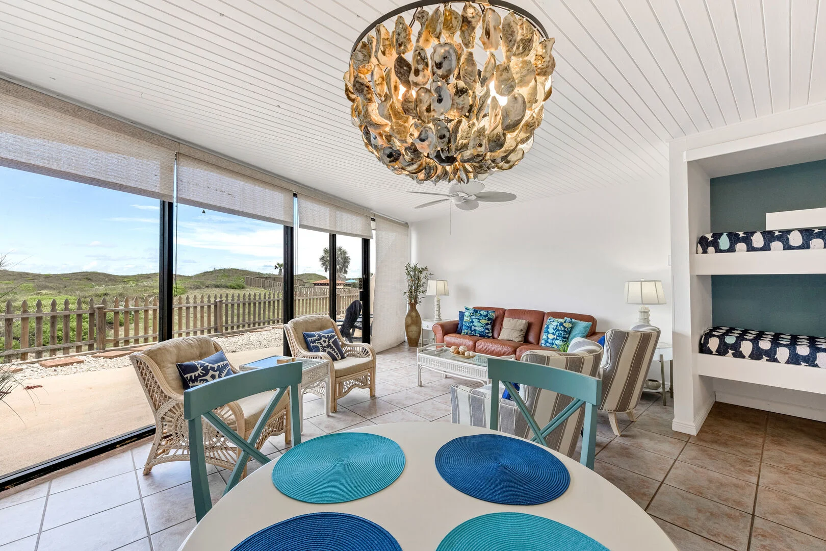 Living area with oyster shell chandelier